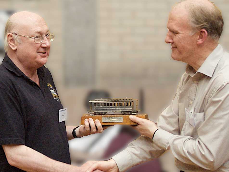 Rod Allcock is presented the 2011 David Lloyd Trophy by Andrew Burnham