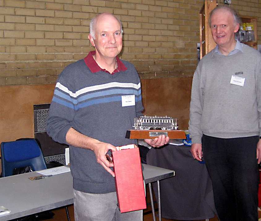 Paul Titmuss is presented the 2013 David Lloyd Trophy by Andrew Burnham