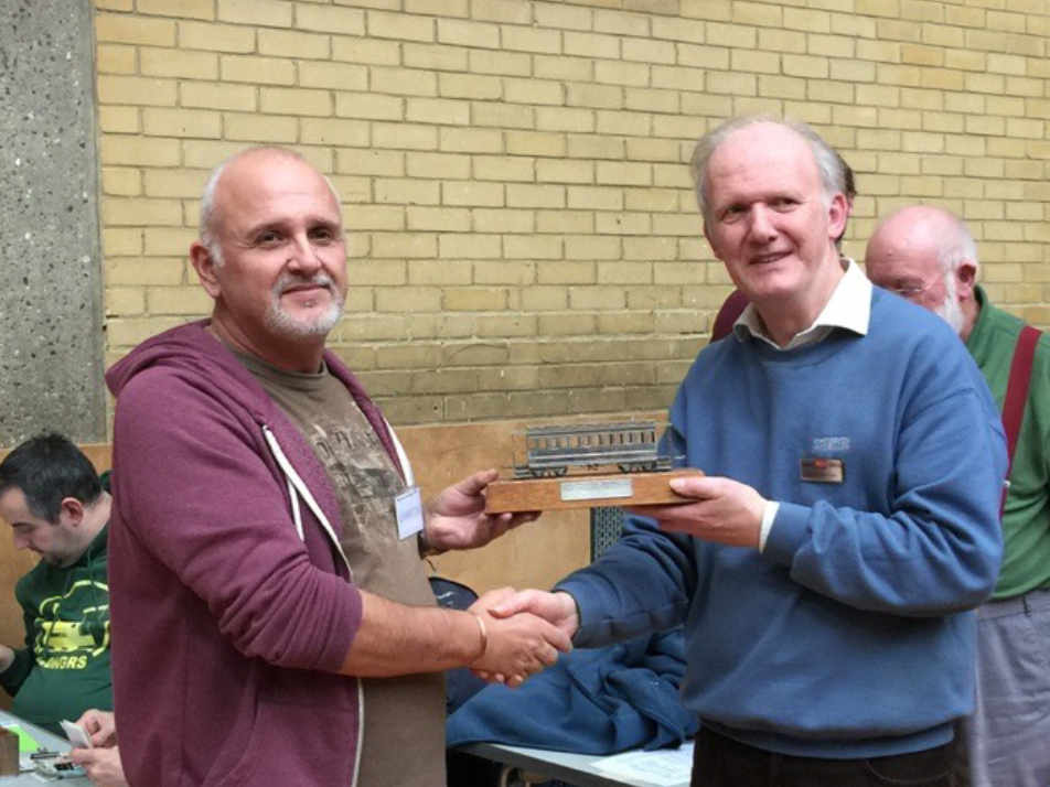 David Ward is presented the 2017 David Lloyd Trophy by Andrew Burnham